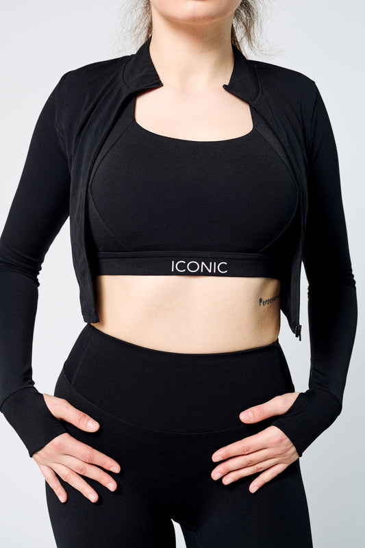 Woman wearing ICONIC Sculpting Leggings and jacket in black