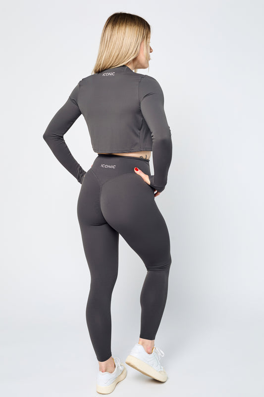 Woman wearing ICONIC Sculpting Leggings in gray