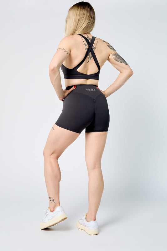 Woman wearing ICONIC Sculpting top in gray