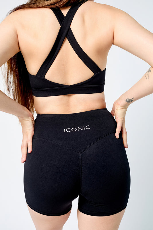 Woman wearing ICONIC Sculpting top in black